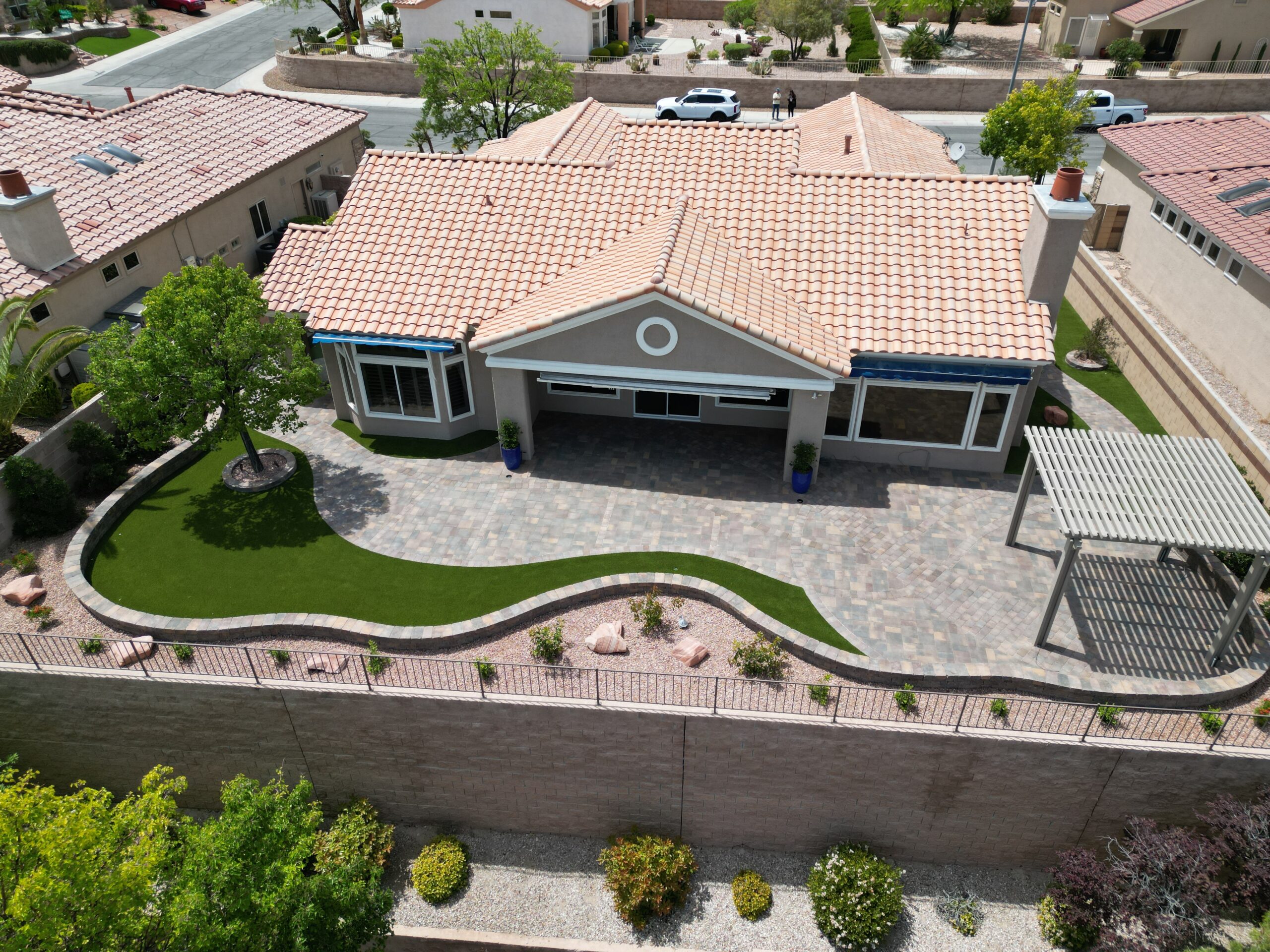 A house with a driveway and patio area.