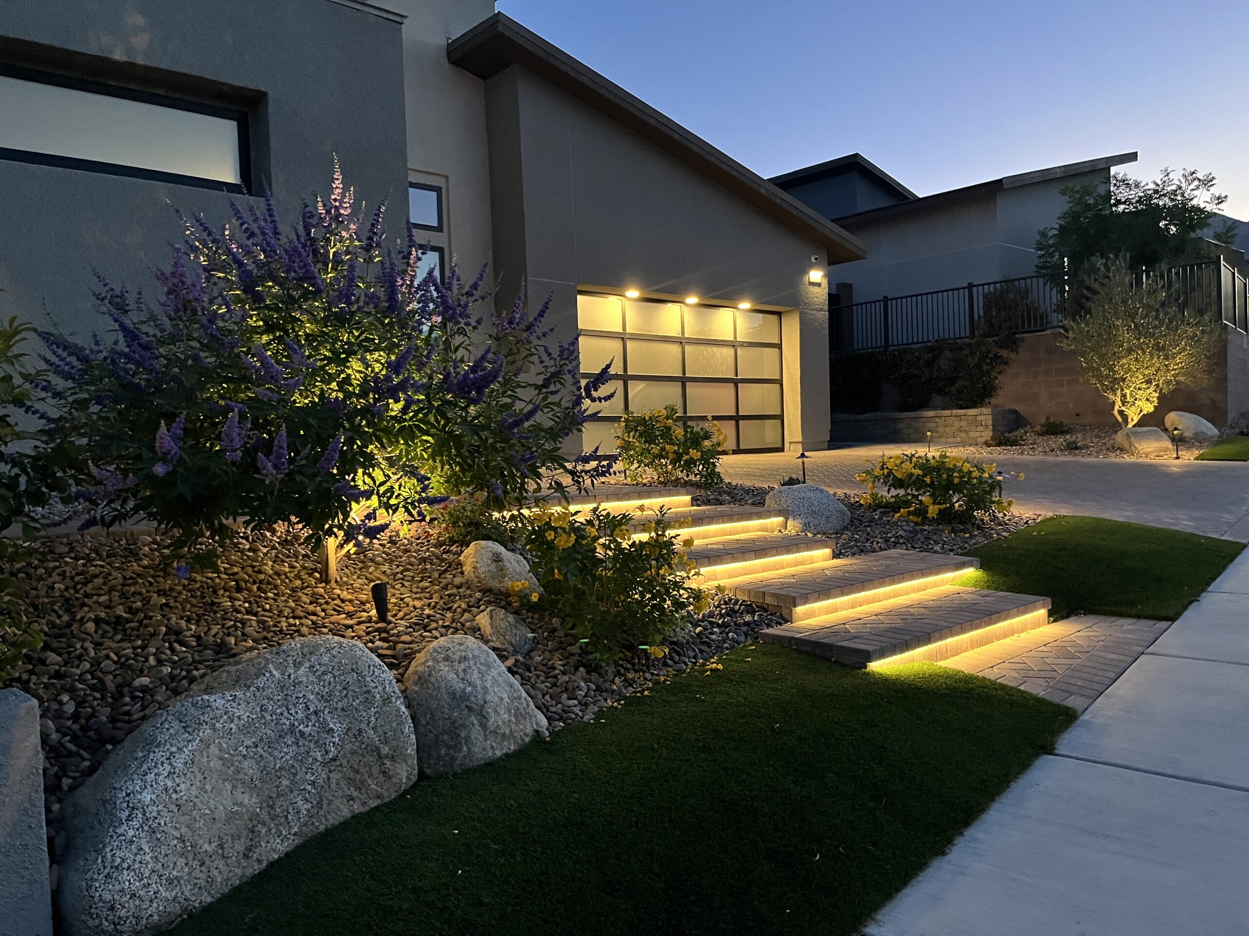 A house with steps and plants in the yard