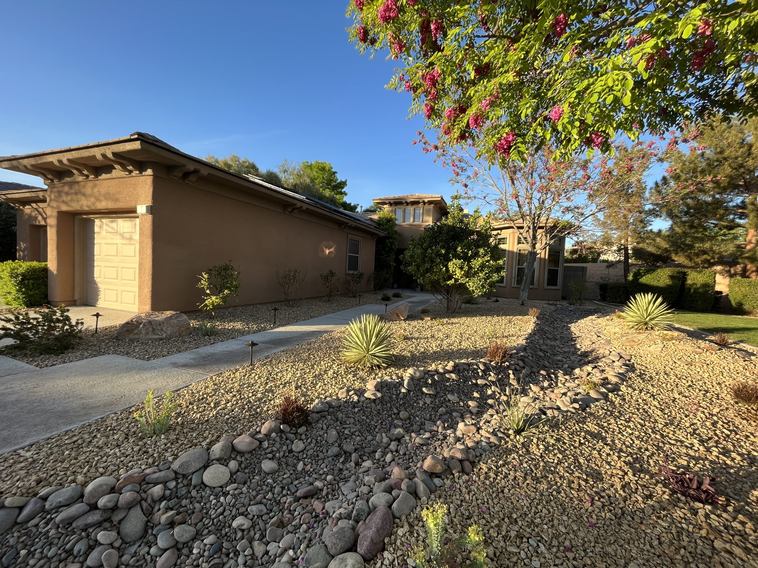 A house with a lot of rocks in front of it